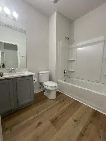 a view of a room with a wooden floor