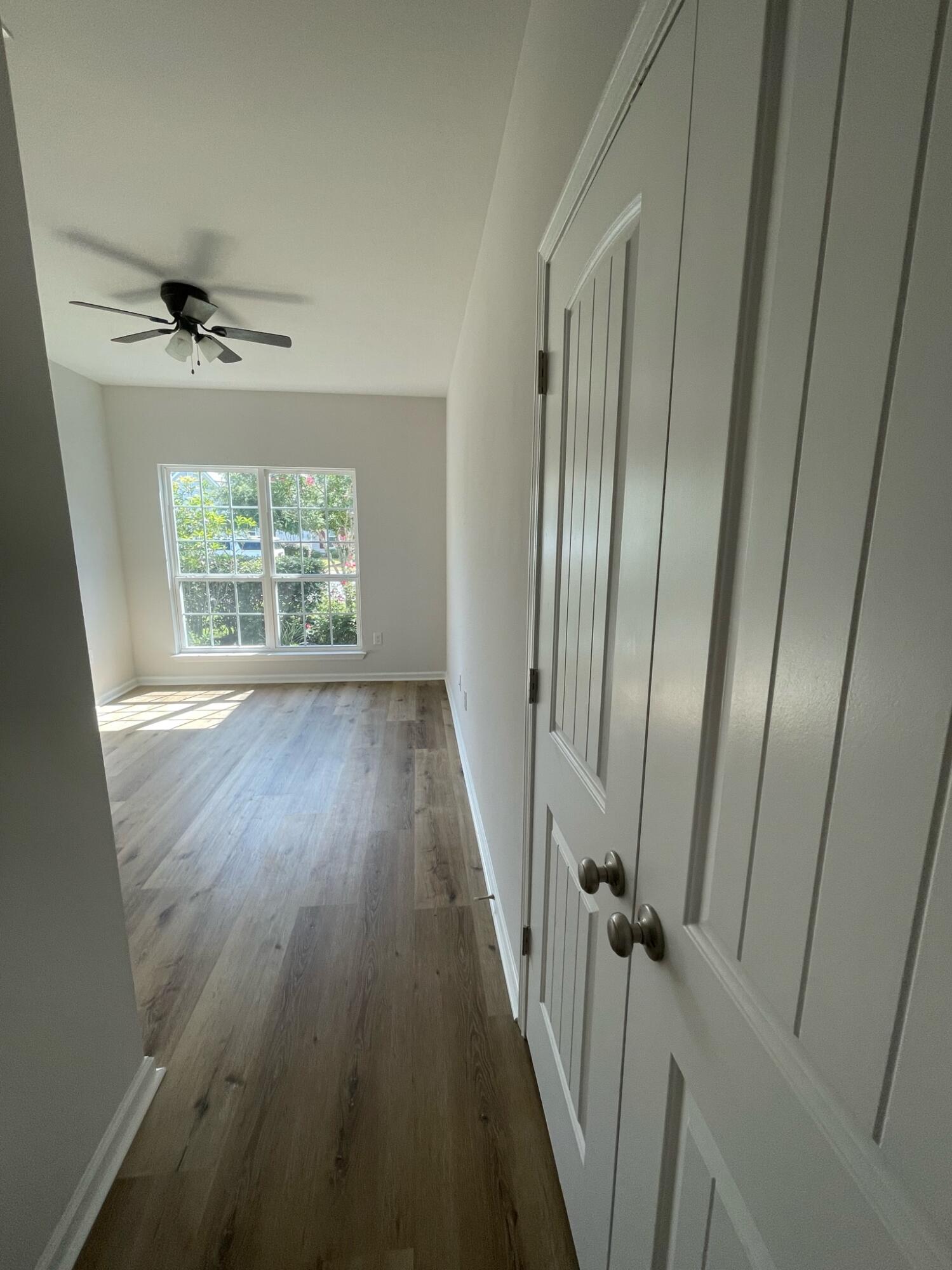 56 Lilly Bell Lane Freeport, FL 32439 - Photo 10 of 20 a view of a room with a wooden floor
