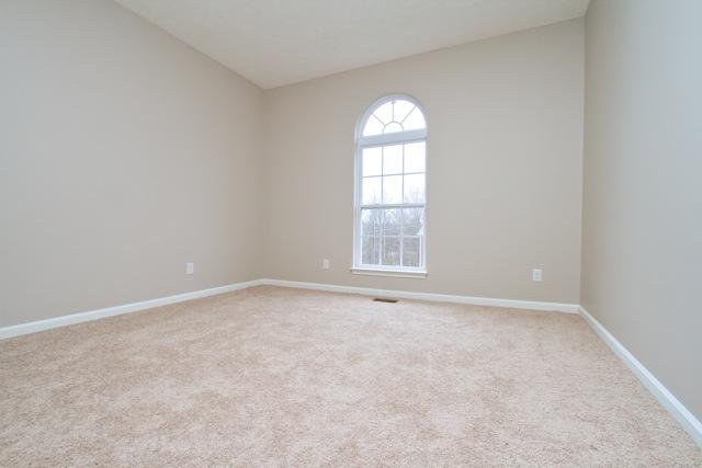 7588 Cherokee Hills Road Fairview, TN 37062 - Photo 12 of 18 The home features two nearly identical bedrooms with arch topped windows that overlook the front yard.