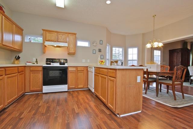 7588 Cherokee Hills Road Fairview, TN 37062 - Photo 8 of 18 There is plenty of kitchen storage in the warm wood cabinetry plus the pantry.