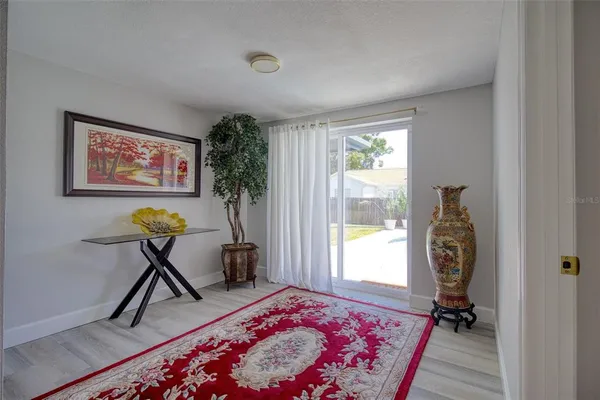 a living room with furniture and a rug