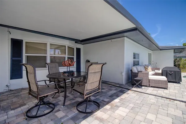 a view of a swimming pool with a patio