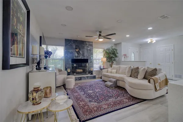 a living room with furniture and a fireplace