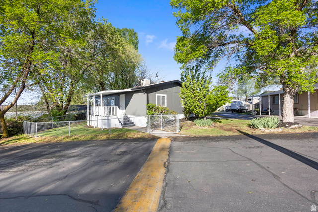 96 Barrington Way Layton, UT 84041 - Photo 18 of 28 View of front facade with a gate and a fenced front yard