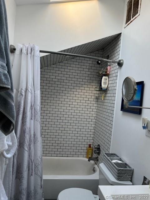 11 Shawnee Road Trumbull, CT 06611 - Photo 9 of 14 a bathroom with a sink a toilet and shower