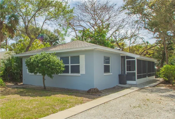a balcony view with a couch and wooden floor
