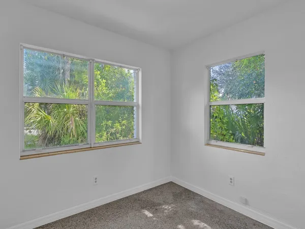 a white bath tub sitting next to a white toilet and a sink