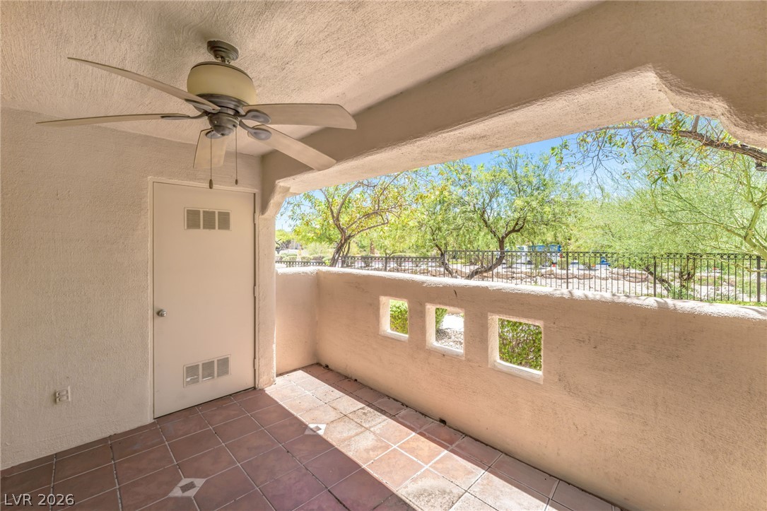 1901 Rio Canyon Court, Unit 102 Las Vegas, NV 89128 - Photo 19 of 23 Relax on this private patio, offering tile flooring and natural outdoor light.