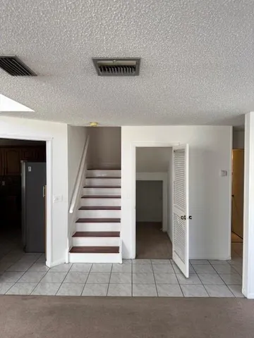 a bathroom with a shower and a toilet