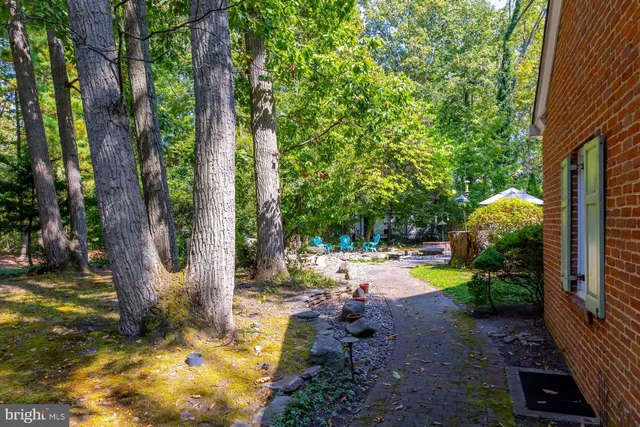 a view of a patio with chairs and a table