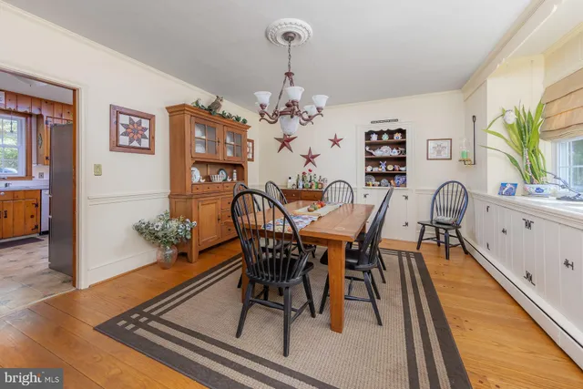 a kitchen with stainless steel appliances granite countertop a refrigerator a stove and a sink