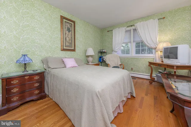 a bathroom with a sink toilet and a window