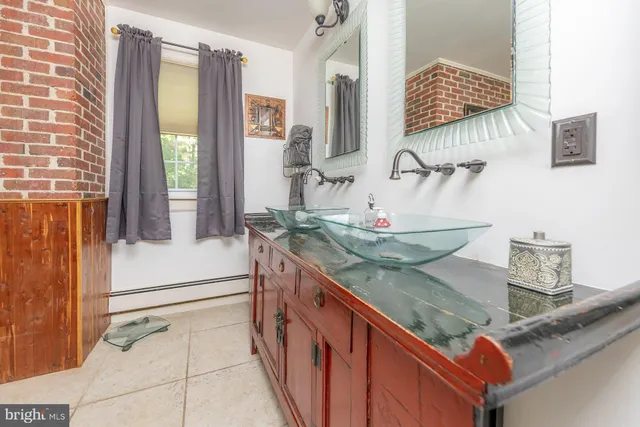 a view of a kitchen with a sink and cabinets