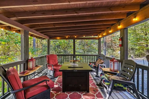 a view of a chairs and table in the patio