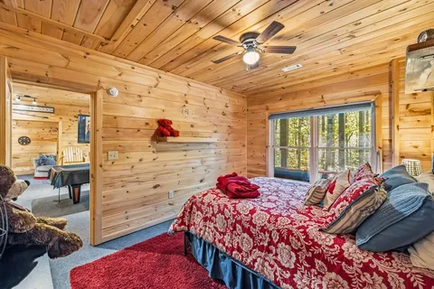 a bed room with a bed and a chair