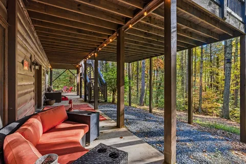 a outdoor space with patio the couches and a dining table with garden view