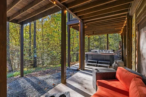 a outdoor living space with furniture and a fireplace