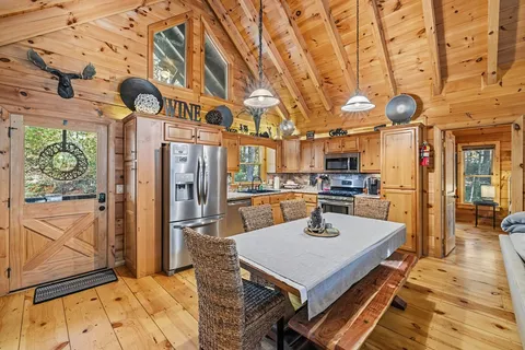 a kitchen with a table and chairs