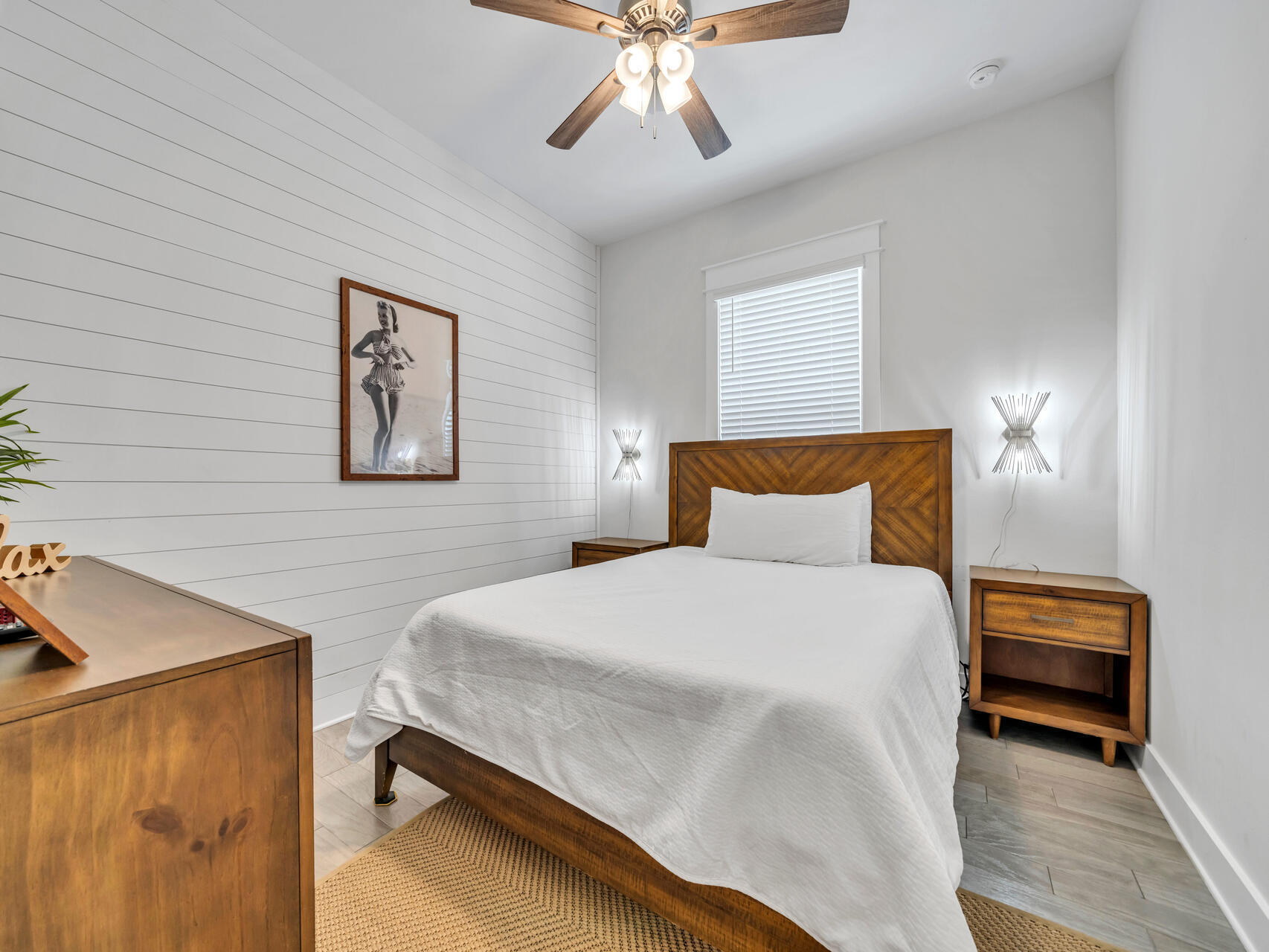 299 Milestone Dr Inlet Beach, Unit A Inlet Beach, FL 32461 - Photo 23 of 41 a bedroom with a bed and a chandelier