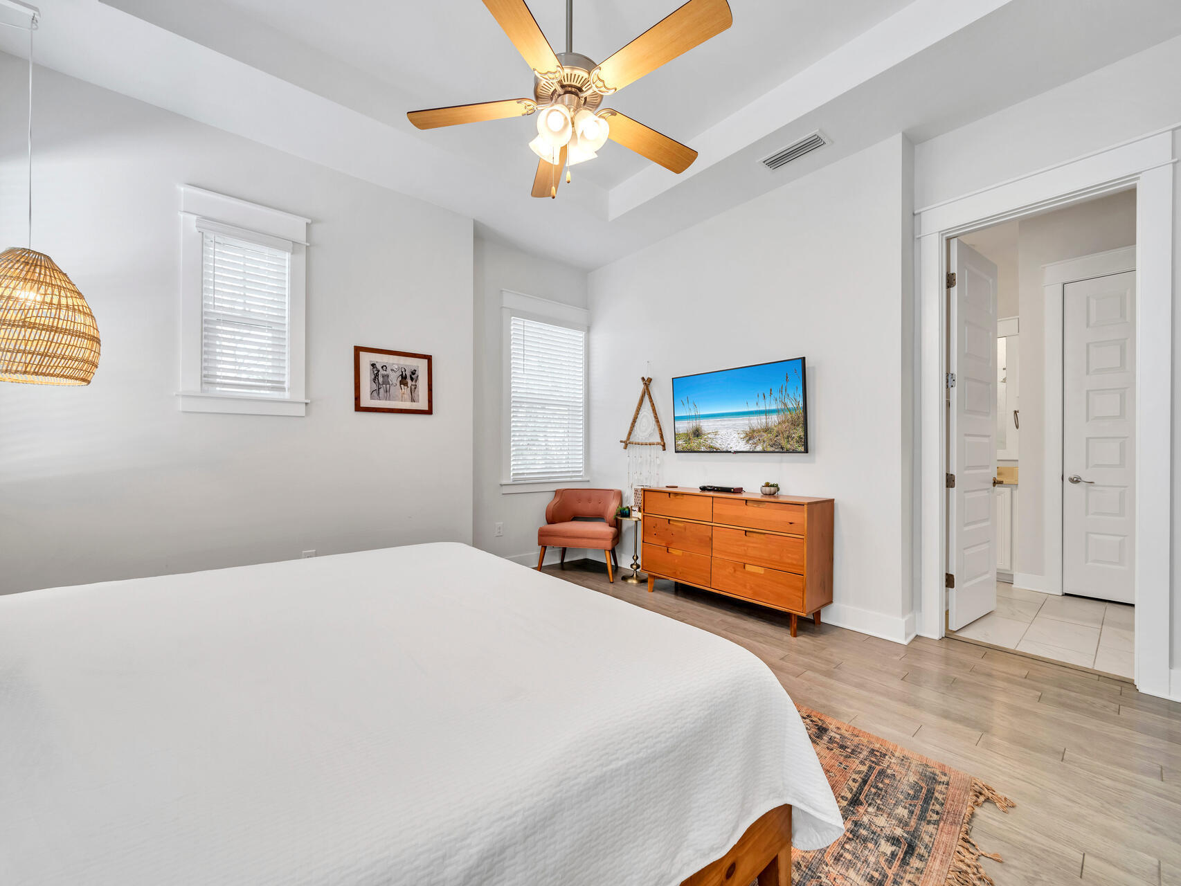 299 Milestone Dr Inlet Beach, Unit A Inlet Beach, FL 32461 - Photo 30 of 41 a bedroom with a bed and a chandelier
