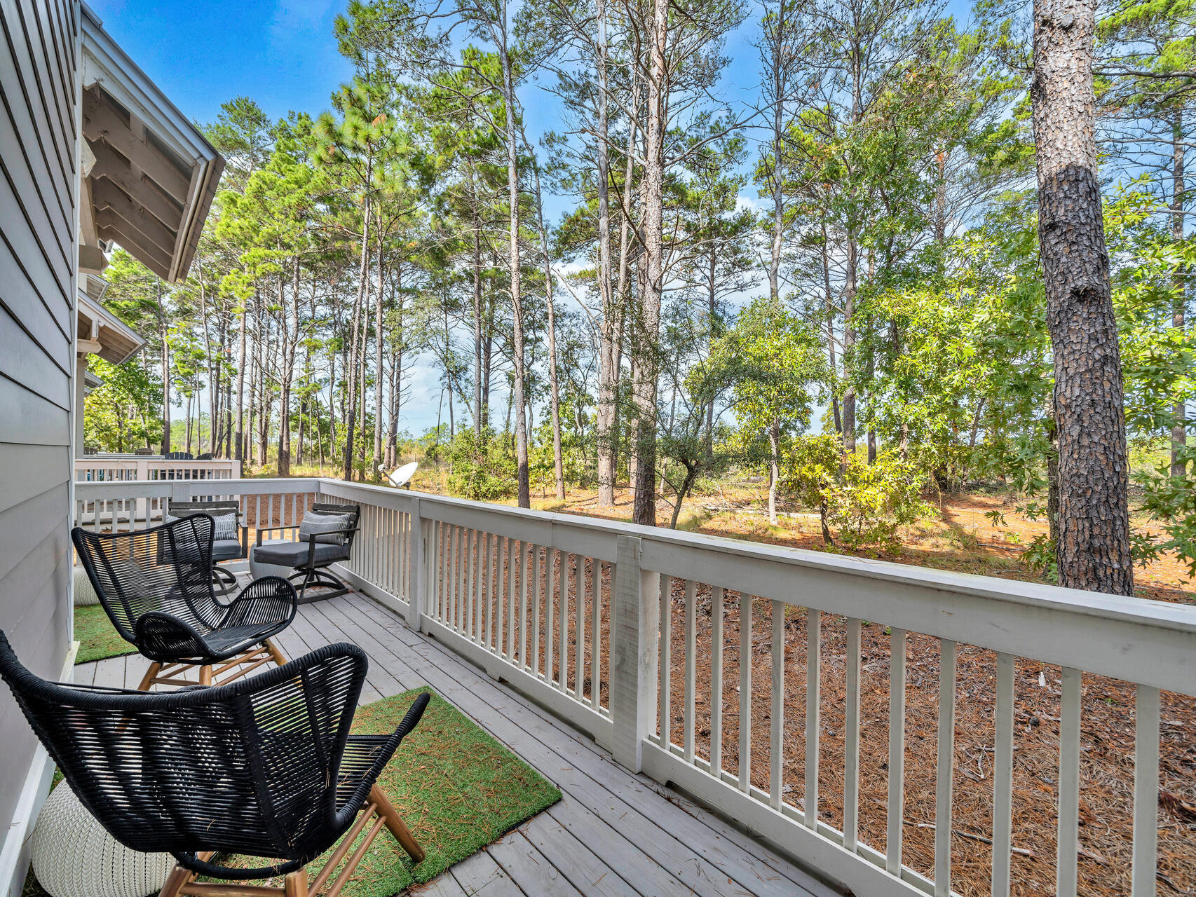 299 Milestone Dr Inlet Beach, Unit A Inlet Beach, FL 32461 - Photo 4 of 41 a view of a chair and table in the balcony