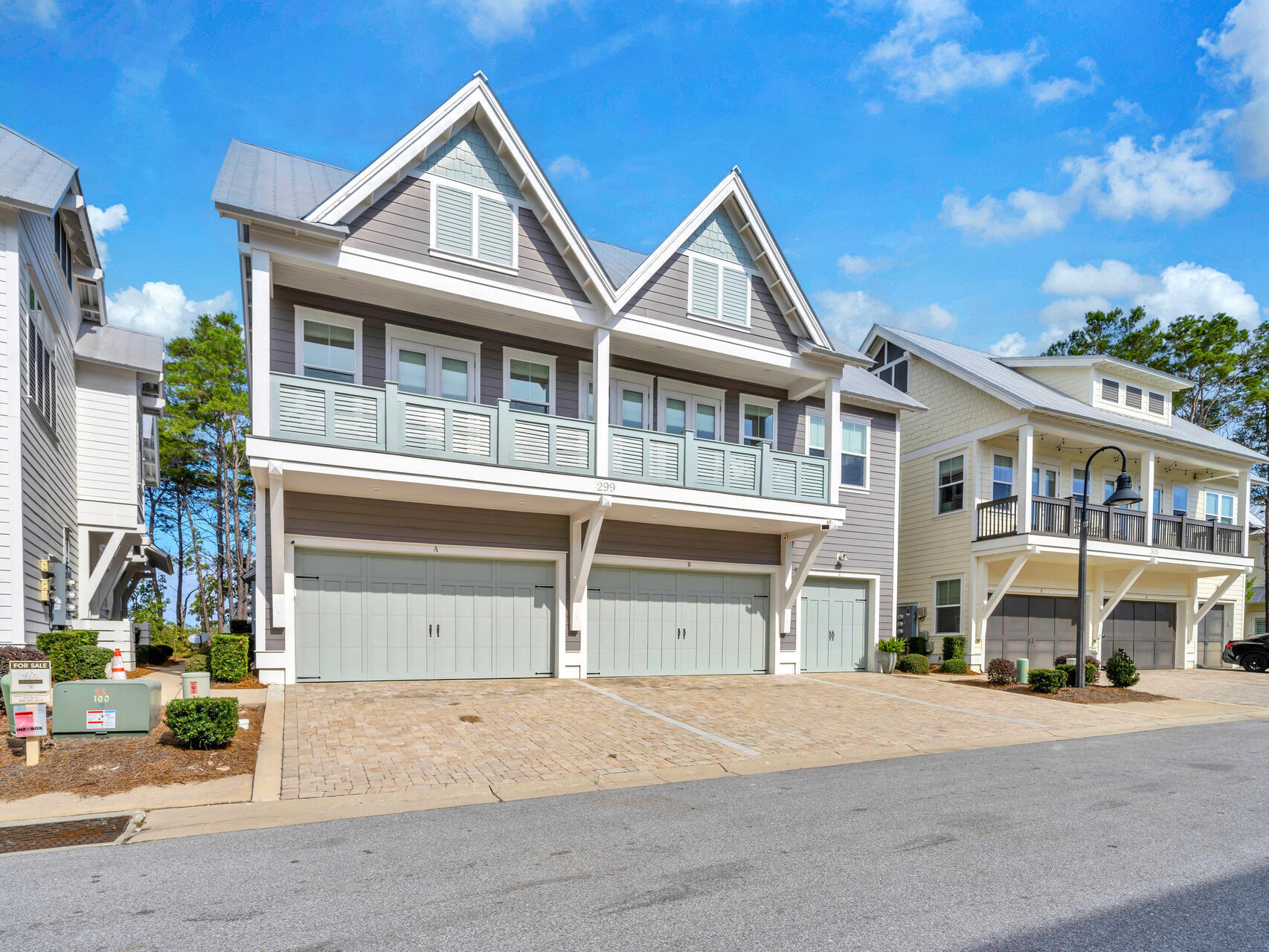 299 Milestone Dr Inlet Beach, Unit A Inlet Beach, FL 32461 - Photo 6 of 41 a front view of a house with a yard and garage