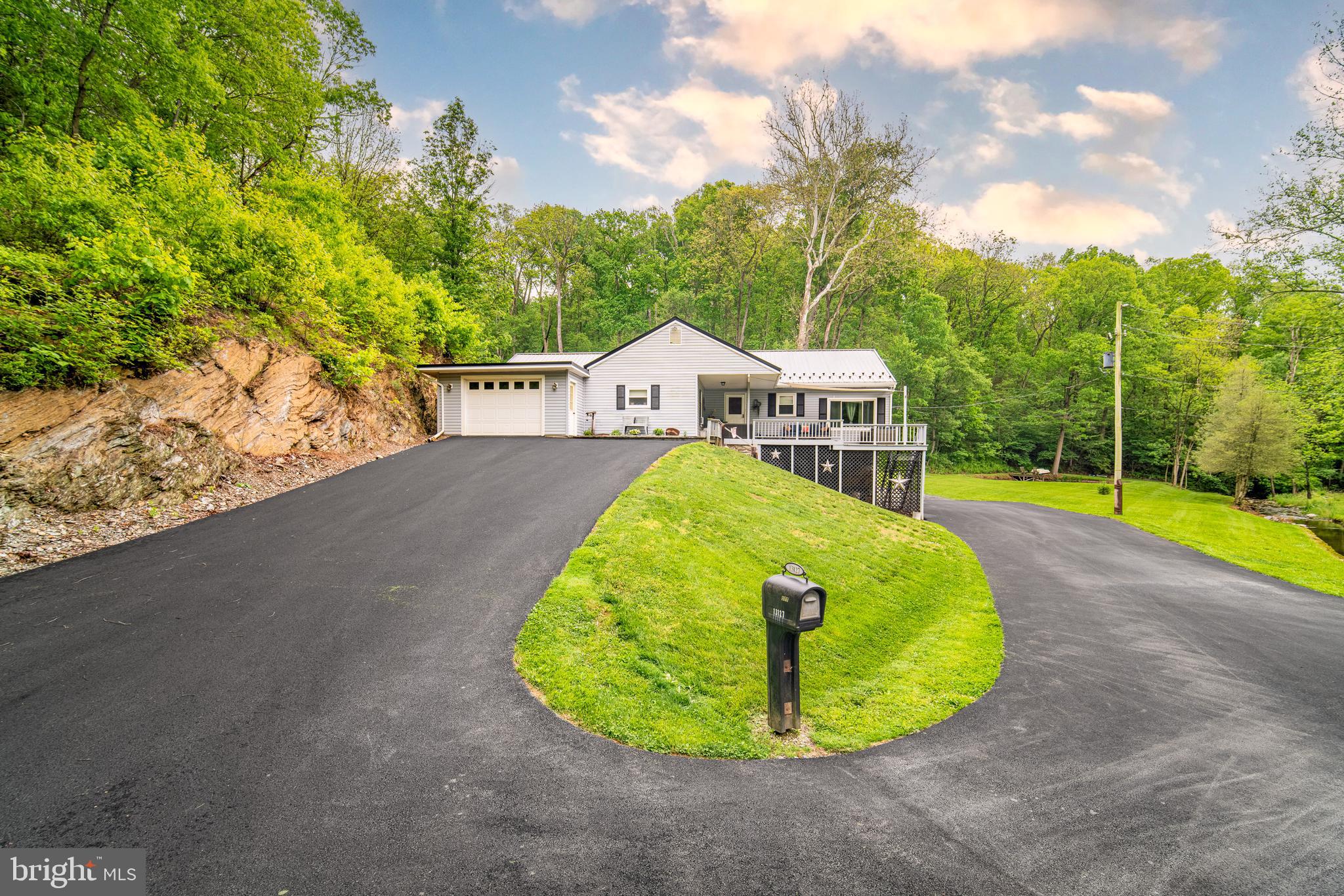 13127 Manor Furnace Road Brogue, PA 17309 - Photo 1 of 78 a view of a swimming pool with a sitting area