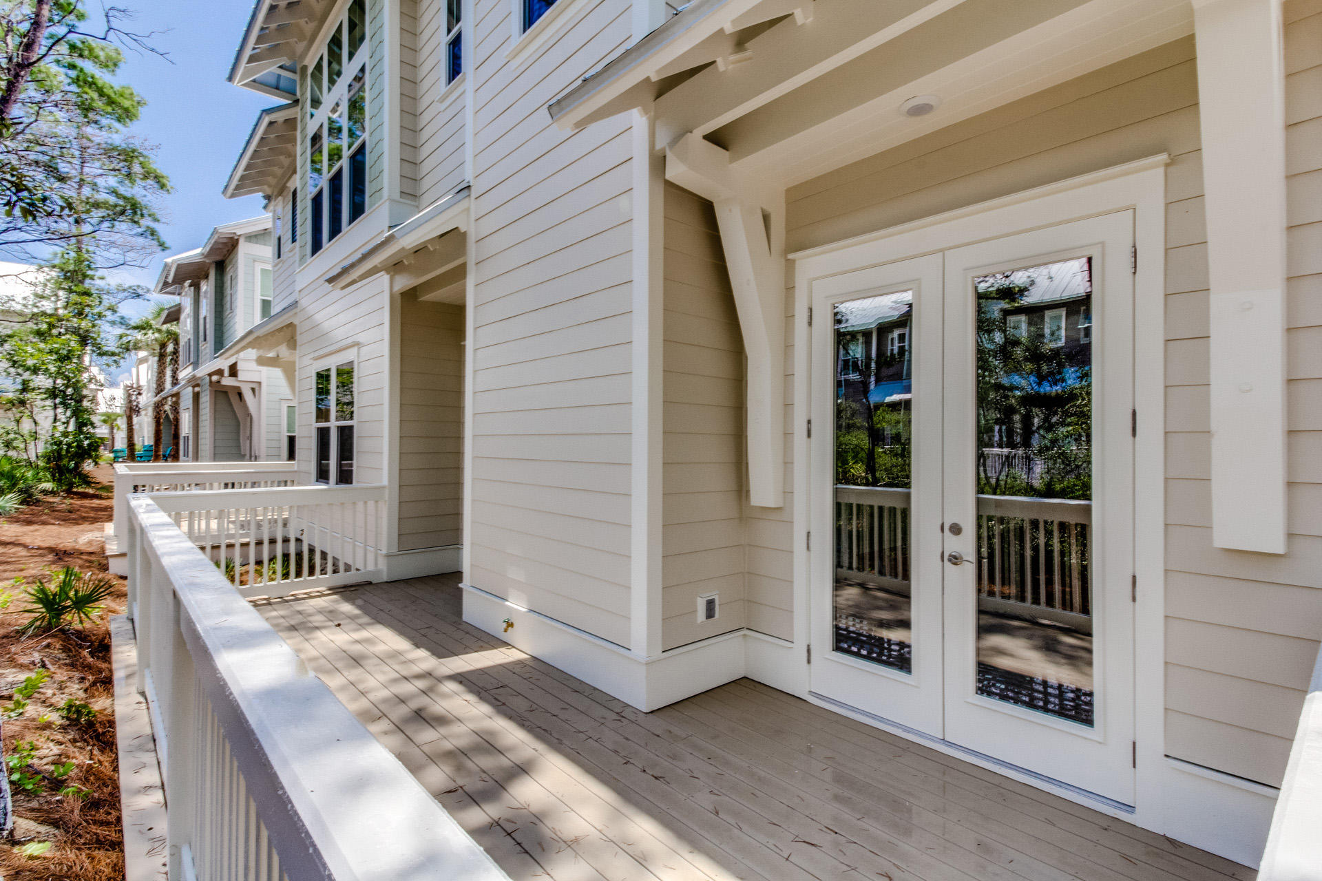 146 Pine Lands Loop Inlet Beach East, Unit A Inlet Beach, FL 32461 - Photo 20 of 42 a view of a house with entrance gate