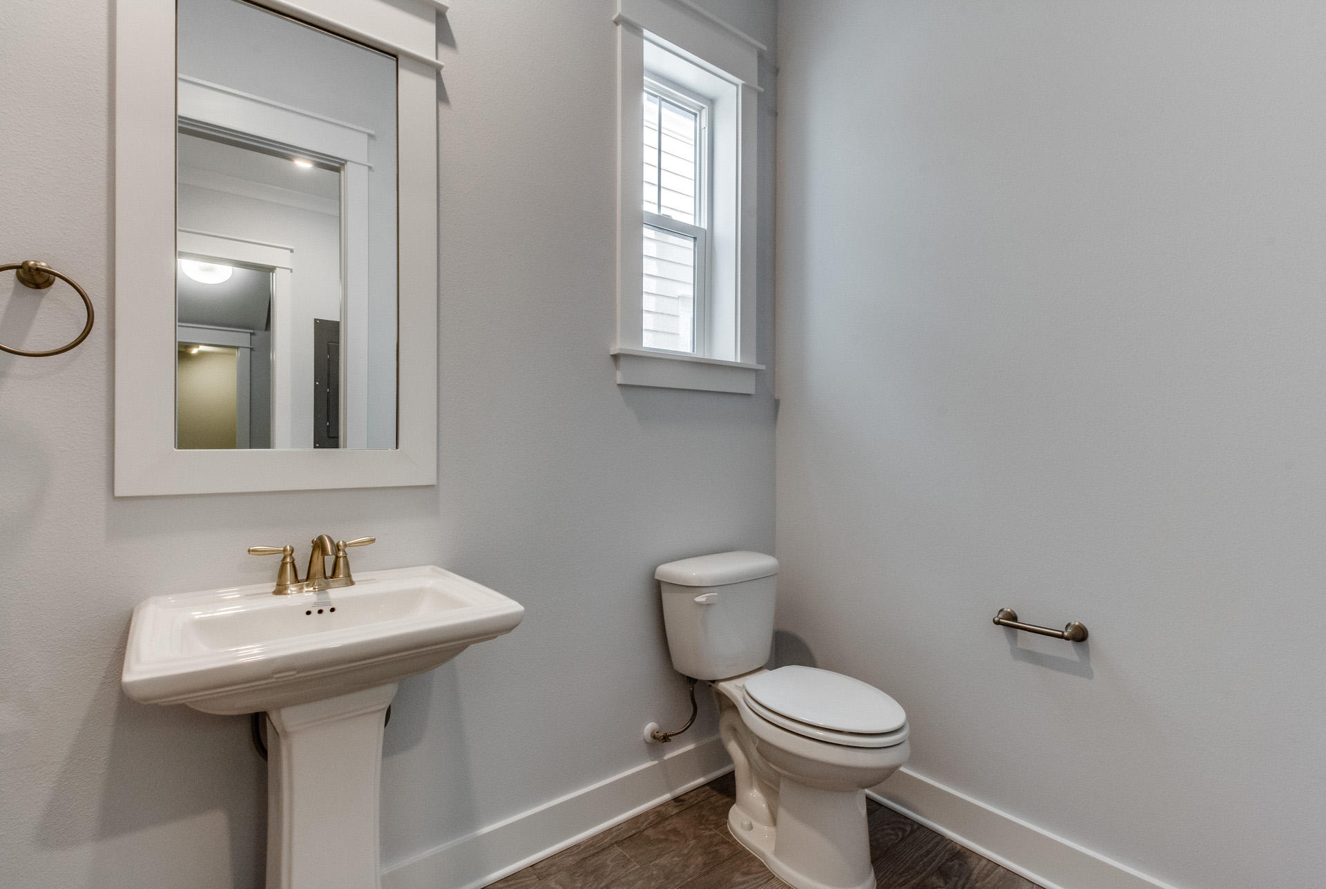 146 Pine Lands Loop Inlet Beach East, Unit A Inlet Beach, FL 32461 - Photo 39 of 42 a bathroom with a toilet sink and mirror