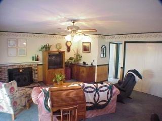 1502 Golf Course Drive Rohnert Park, CA 94928 - Photo 3 of 11 a living room with furniture a chandelier and a fireplace