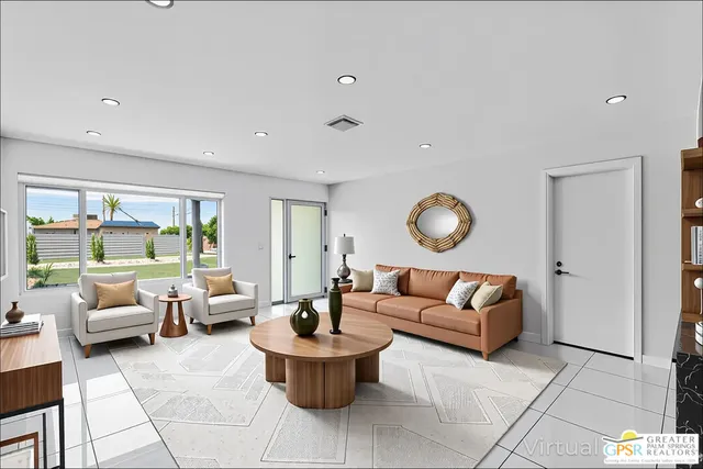 a living room with furniture and a large window