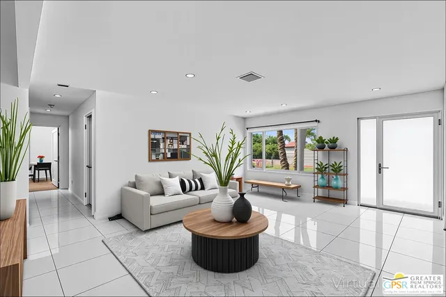 a living room with furniture and a potted plant