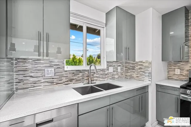 a kitchen with a sink and a window