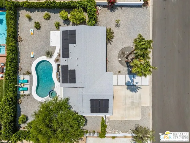 an aerial view of a house with outdoor space