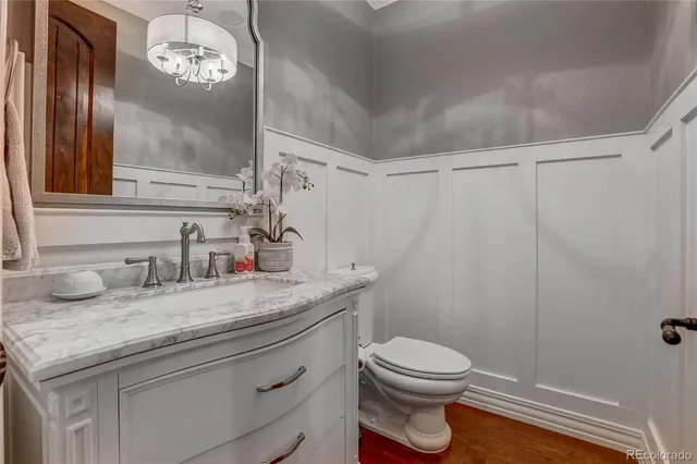 a spacious bedroom with a bed and ceiling fan