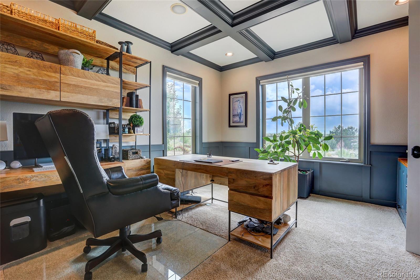 147 Commander Drive Erie, CO 80516 - Photo 14 of 50 a view of a workspace with furniture and a window