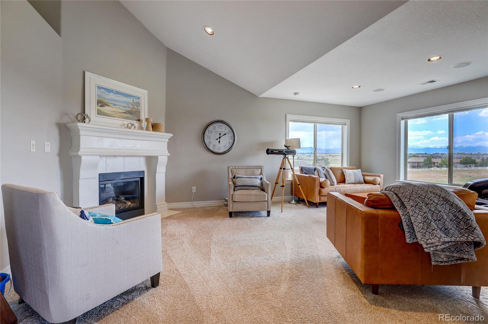 147 Commander Drive Erie, CO 80516 - Photo 17 of 50 a living room with furniture and a fireplace