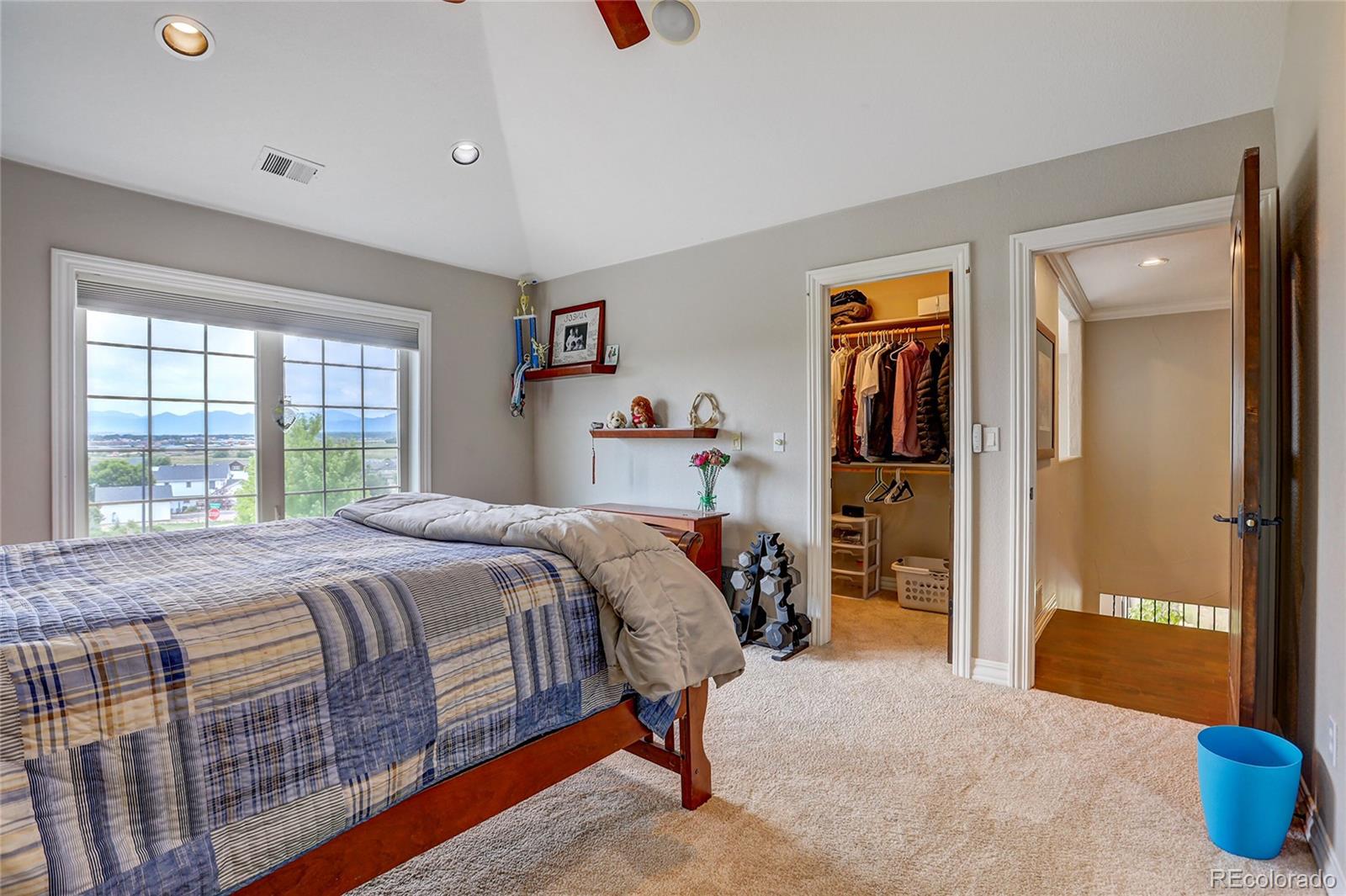 147 Commander Drive Erie, CO 80516 - Photo 22 of 50 a bedroom with a bed and a dresser