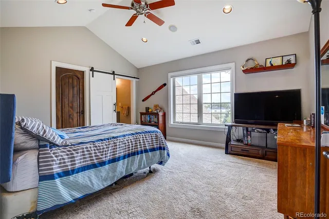 a view of a livingroom with furniture and a window