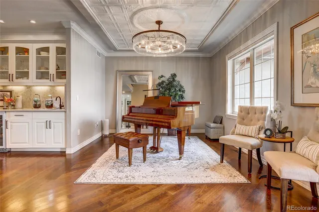 a kitchen with stainless steel appliances kitchen island granite countertop a sink stove and refrigerator