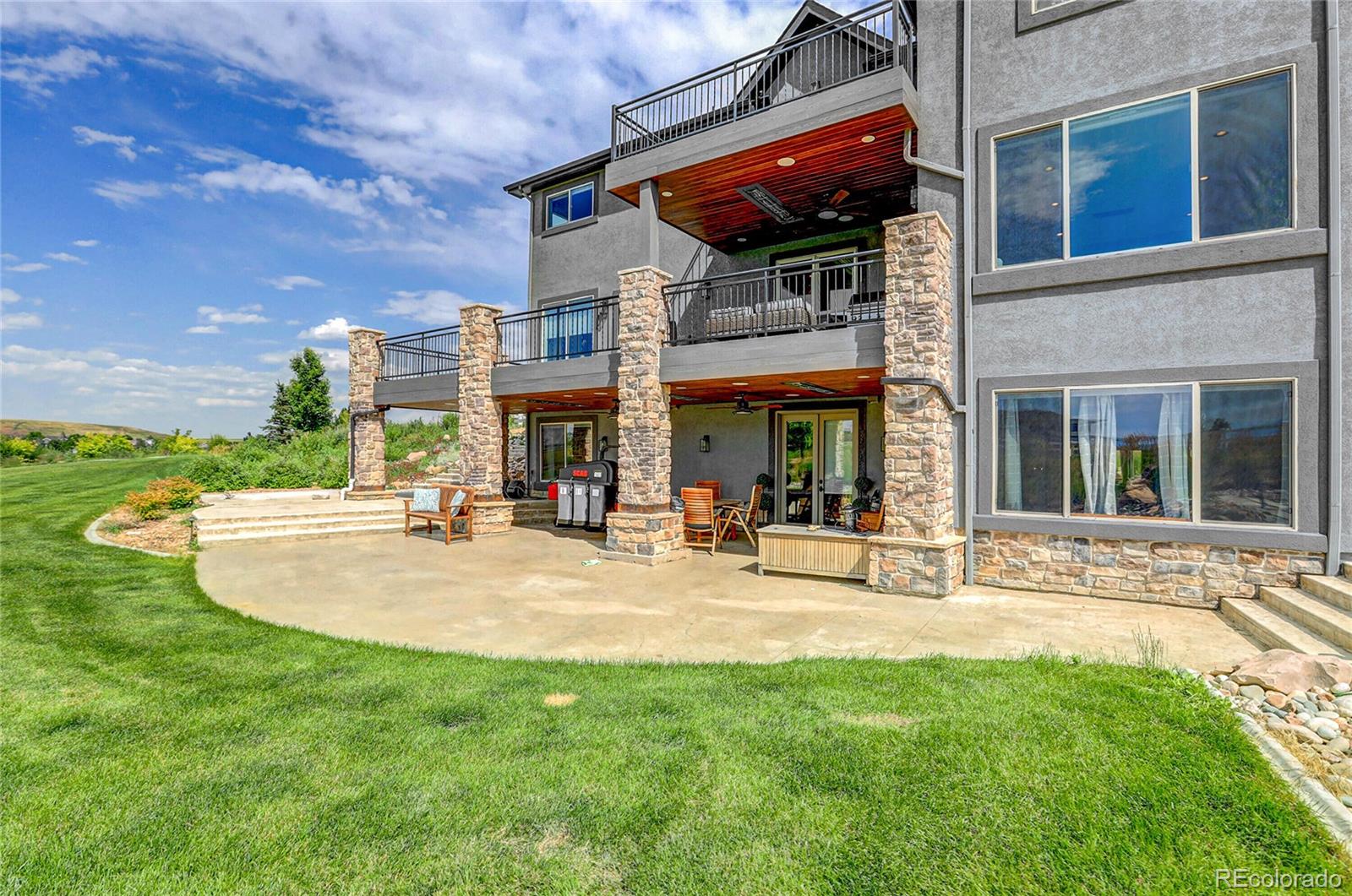 147 Commander Drive Erie, CO 80516 - Photo 39 of 50 a view of a house with sitting area and garden