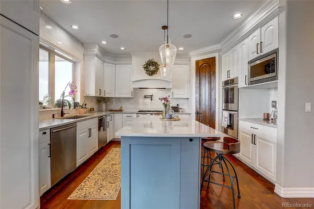 a balcony with furniture and a floor to ceiling window