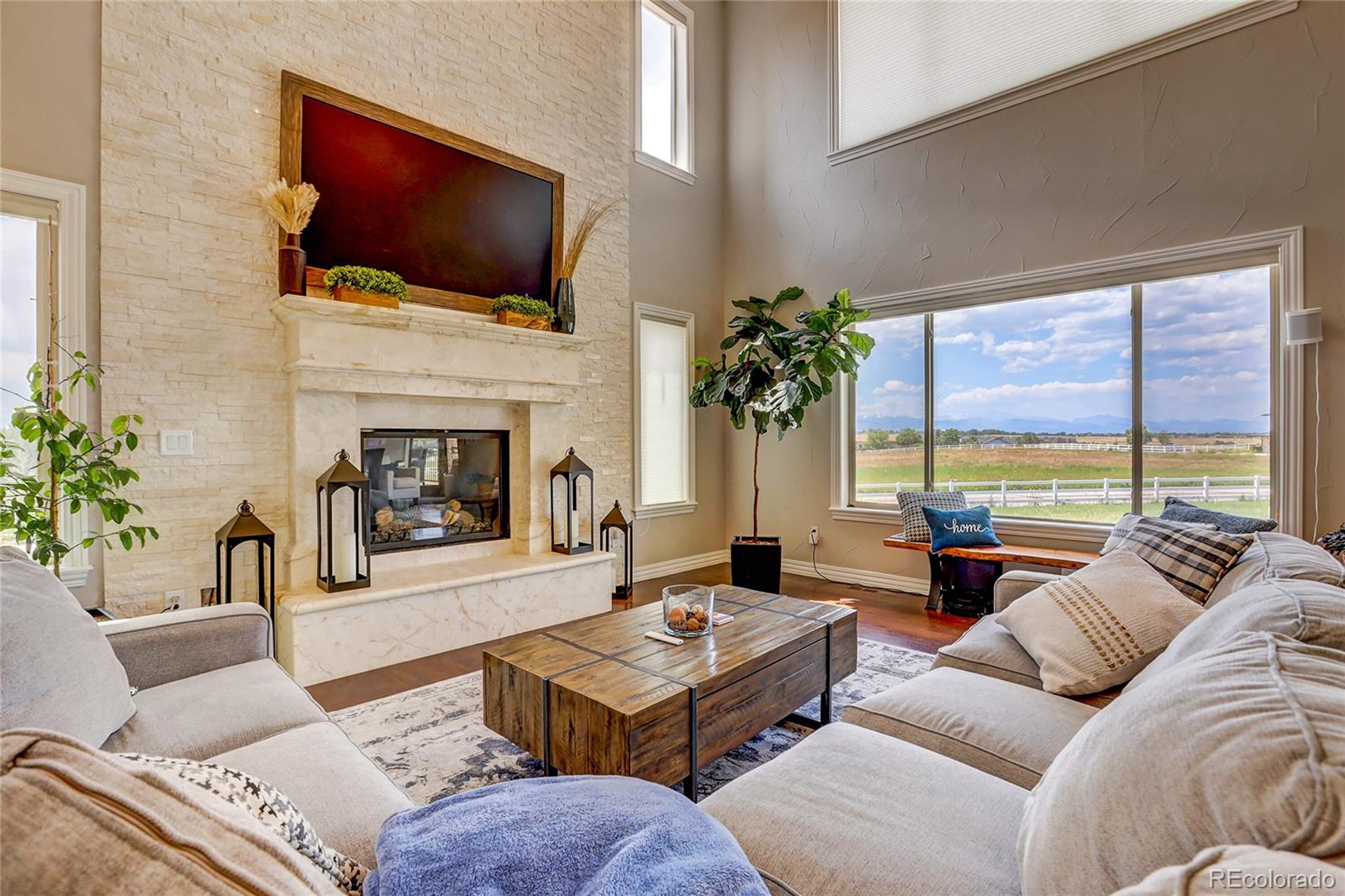 147 Commander Drive Erie, CO 80516 - Photo 9 of 50 a living room with furniture fireplace and flat screen tv