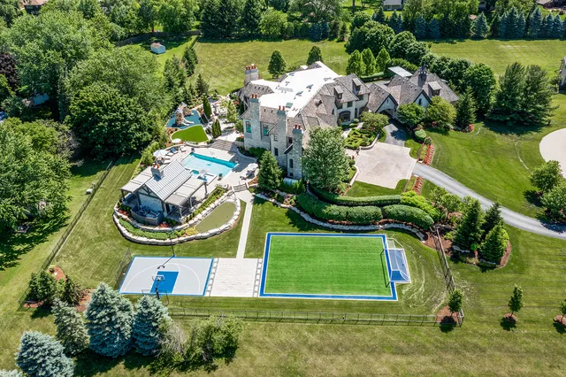 an aerial view of a house with outdoor space patio and mountain view