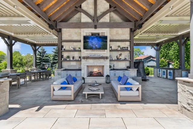 a living room with furniture and a large mirror