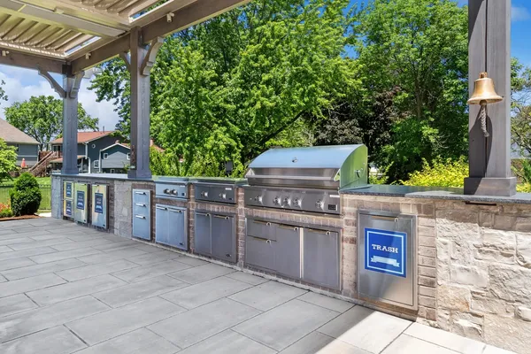 a living room with furniture fireplace and floor to ceiling windows