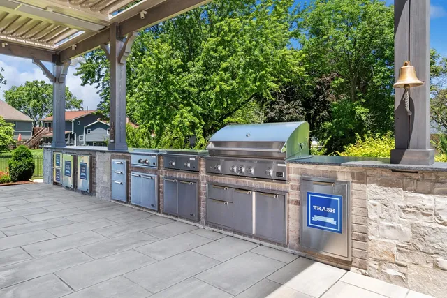 a living room with furniture fireplace and floor to ceiling windows