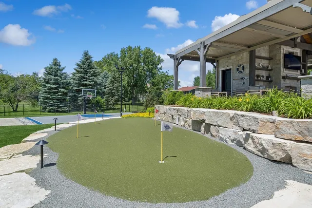 a kitchen with stainless steel appliances kitchen island granite countertop a sink and cabinets