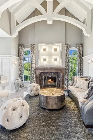 a view of a hallway with wooden floor and stairs