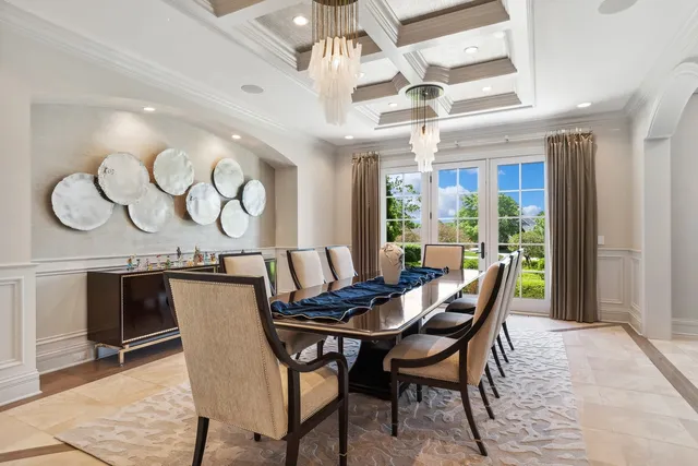 a kitchen with granite countertop kitchen island stainless steel appliances a sink stove and cabinets